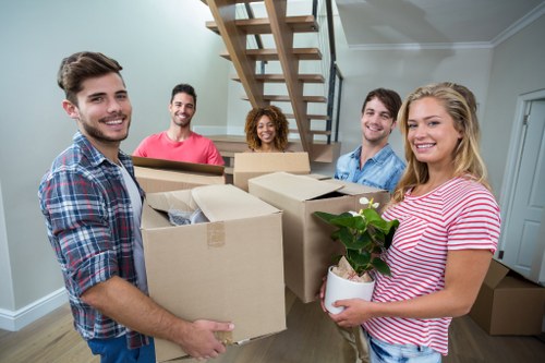Movers handling furniture for a Kentish Town home relocation