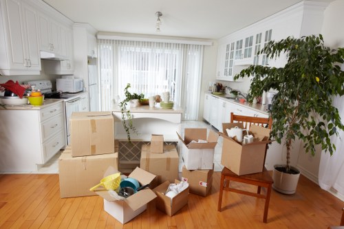 Removal team carefully moving furniture from a period property in Kentish Town