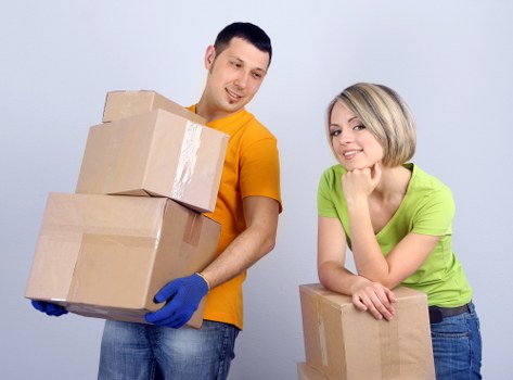 Careful loading of boxes and furniture into a moving van