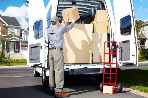 Professional movers handling furniture in a Kentish Town flat