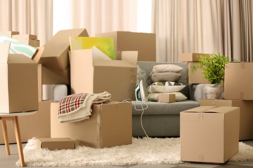 Packed office equipment and furniture ready for transport during a business move