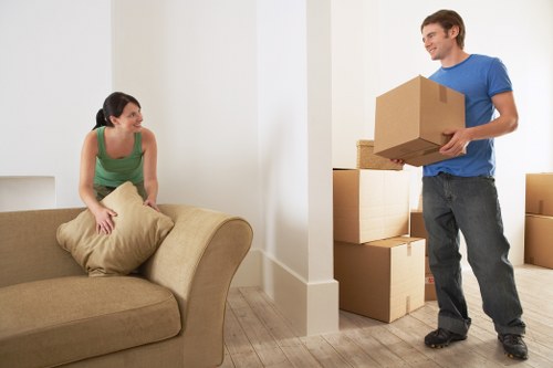A mover handling fragile belongings in a Kentish Town property